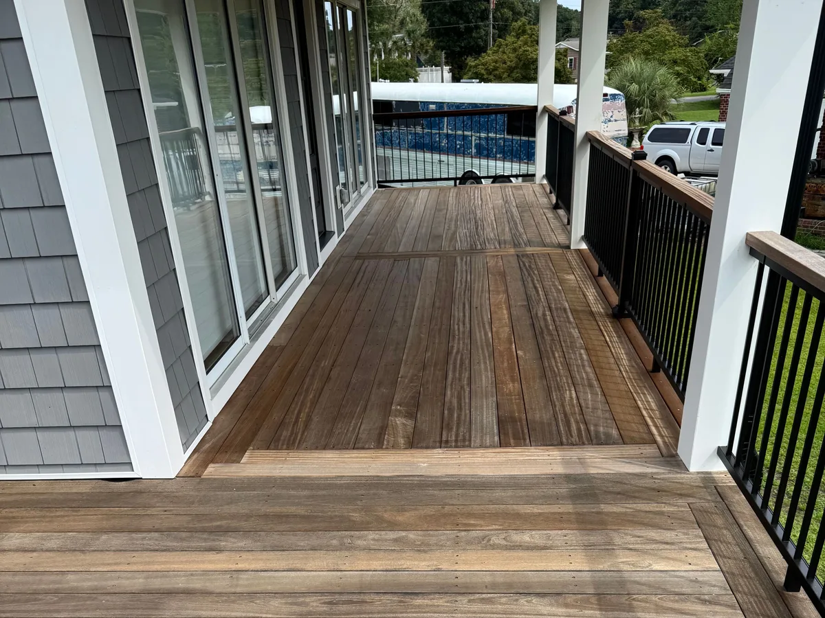 Hardwood deck washed back to bare untreated wood, grey and flat, at a Jacksonville NC home