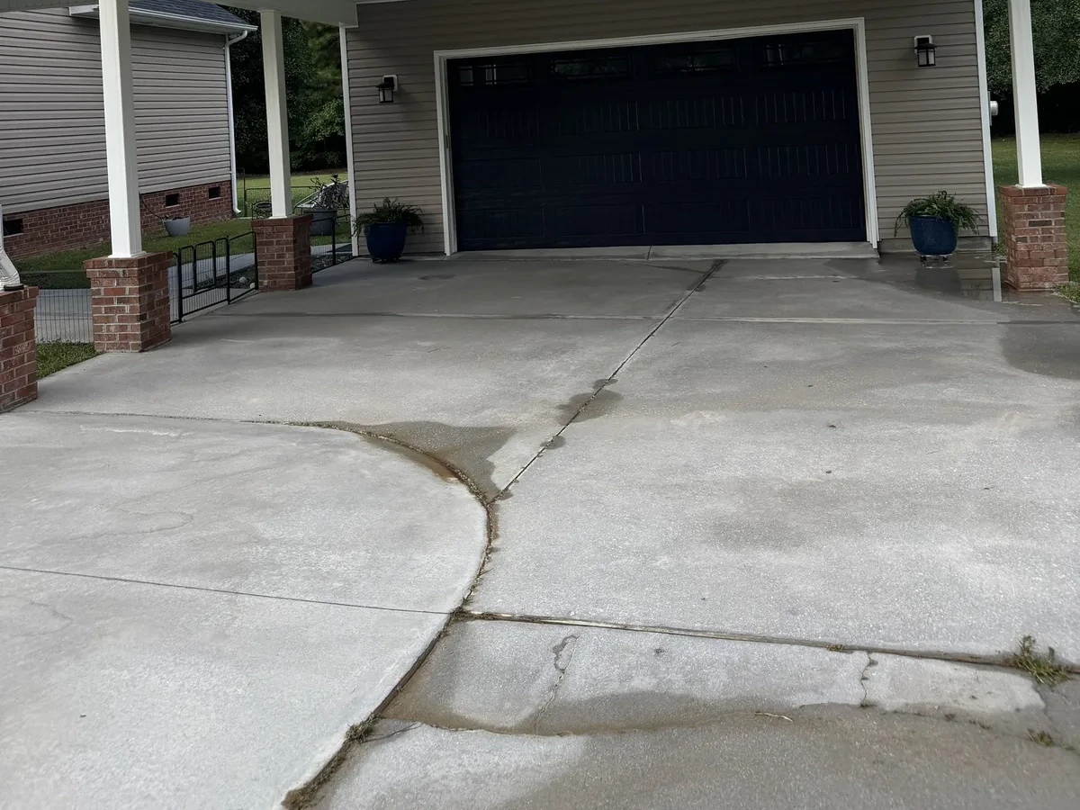 The same carport driveway clean and bright after surface cleaning