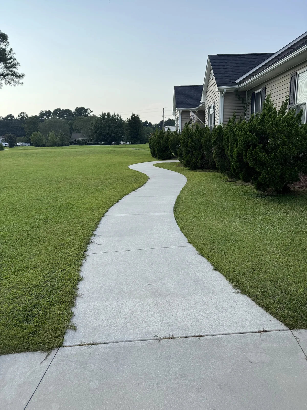 Bright white curved walkway after surface cleaning